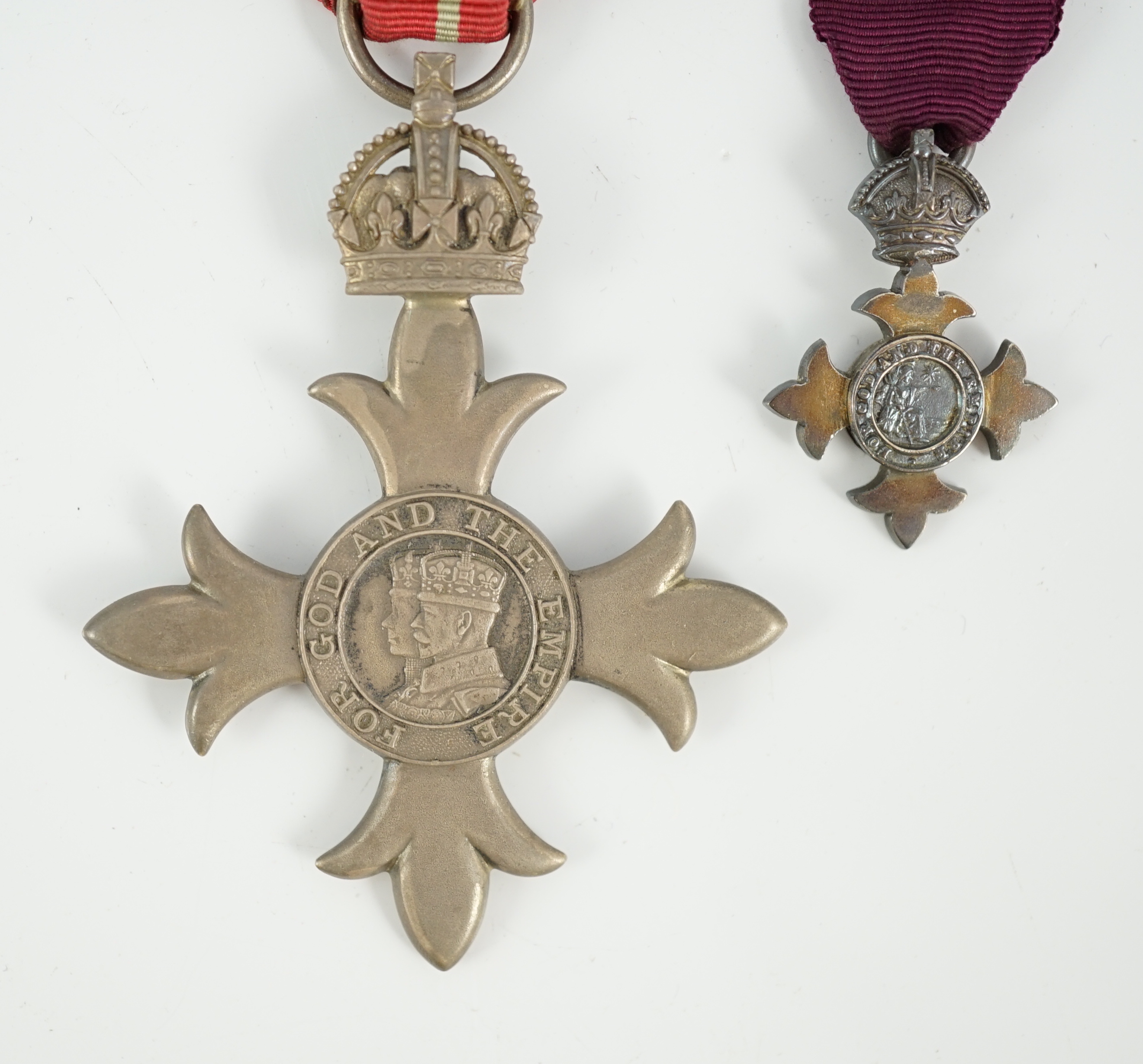 A cased George V military MBE containing leaflet with instructions as to wearing Insignia, together with the separately cased miniature